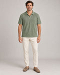 Men's single Army Green polo shirt - neutral studio portrait