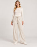 Women's Trousers in Apricot on a neutral background