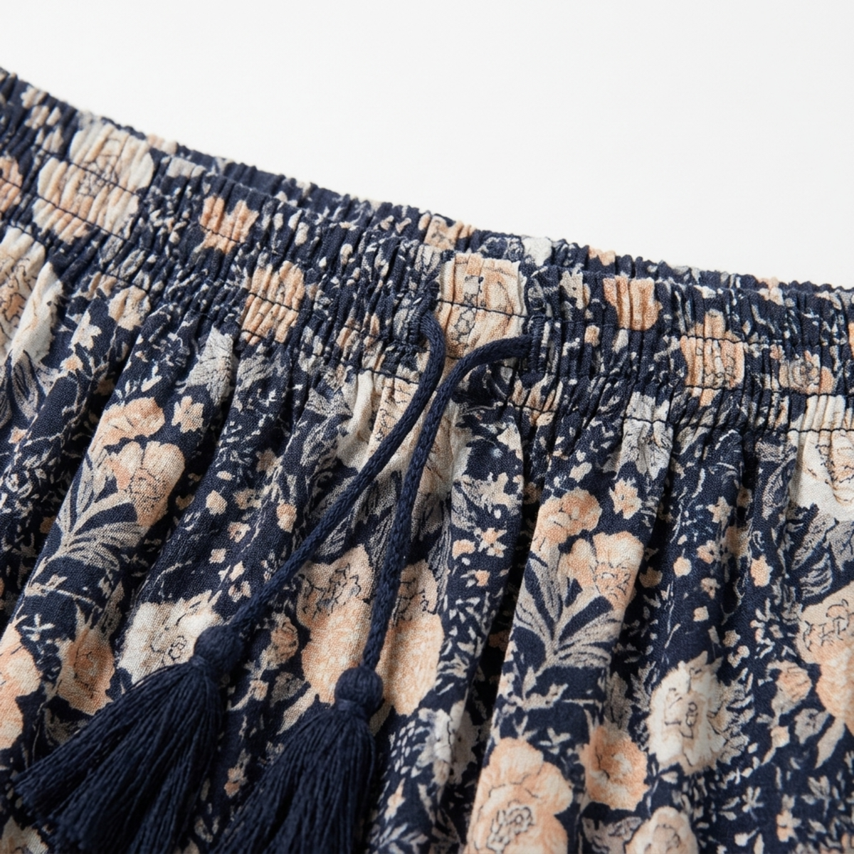 Long floral maxi skirt — trapeze cut with tassels — summer vacation — product view