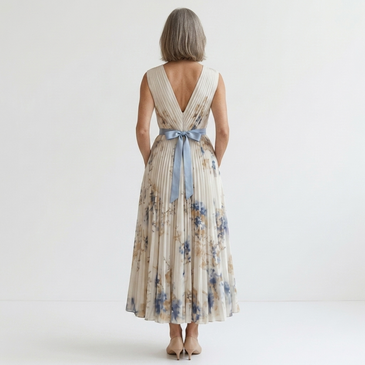 Mid-length floral dress — V-neck and pleated skirt with pockets — White