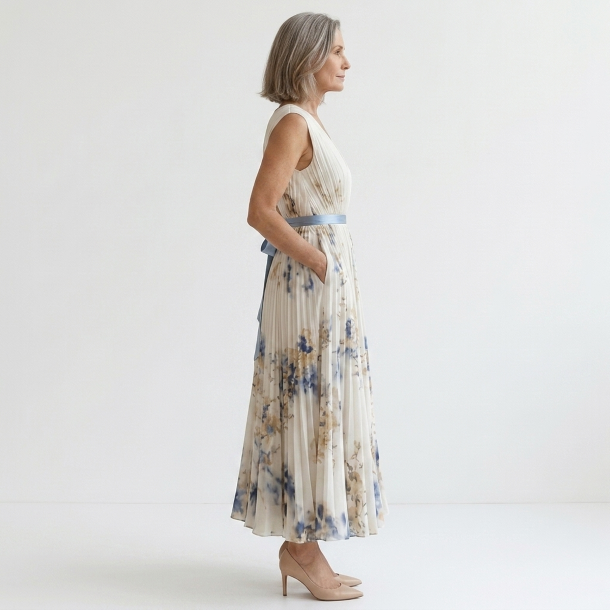 Mid-length floral dress — V-neck and pleated skirt with pockets — White