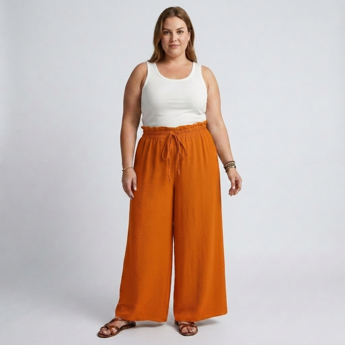 Wide large size pants for women with elastic waistband and drawstring — Orange