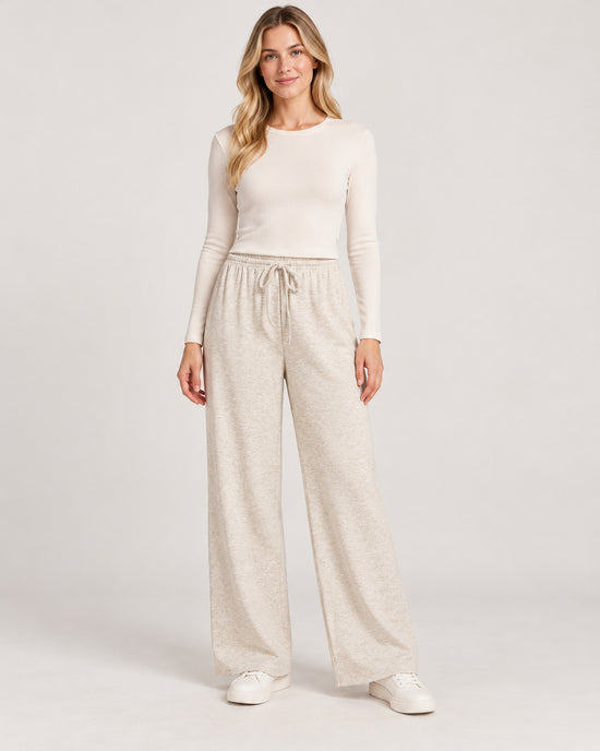 Women's Trousers in Apricot on a neutral background