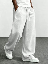 Men's light grey drawstring relaxed-fit trousers, original product view