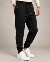 Men's black drawstring jogger trousers on a neutral background