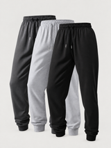 Three-pair trouser set in black, light grey and dark grey