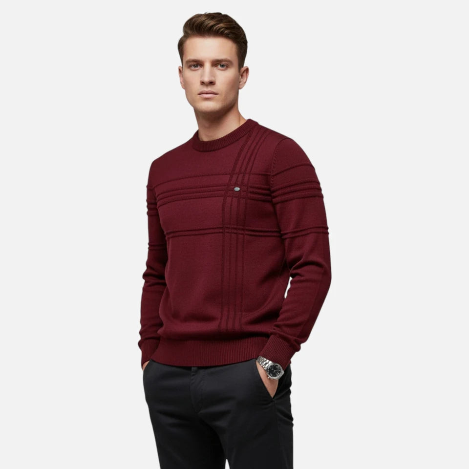 A man wearing a burgundy jumper.